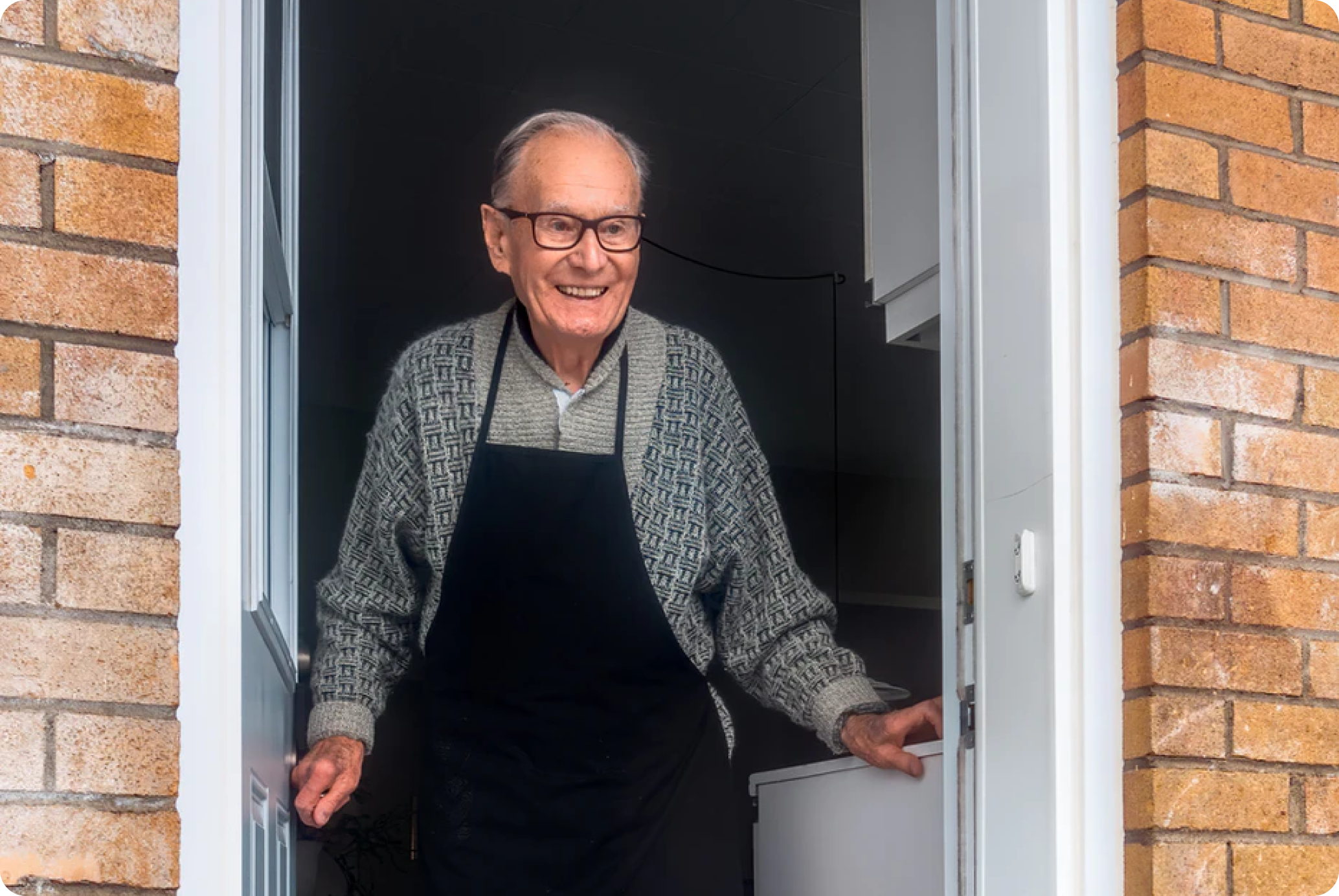 An older person smiling as care begins at home