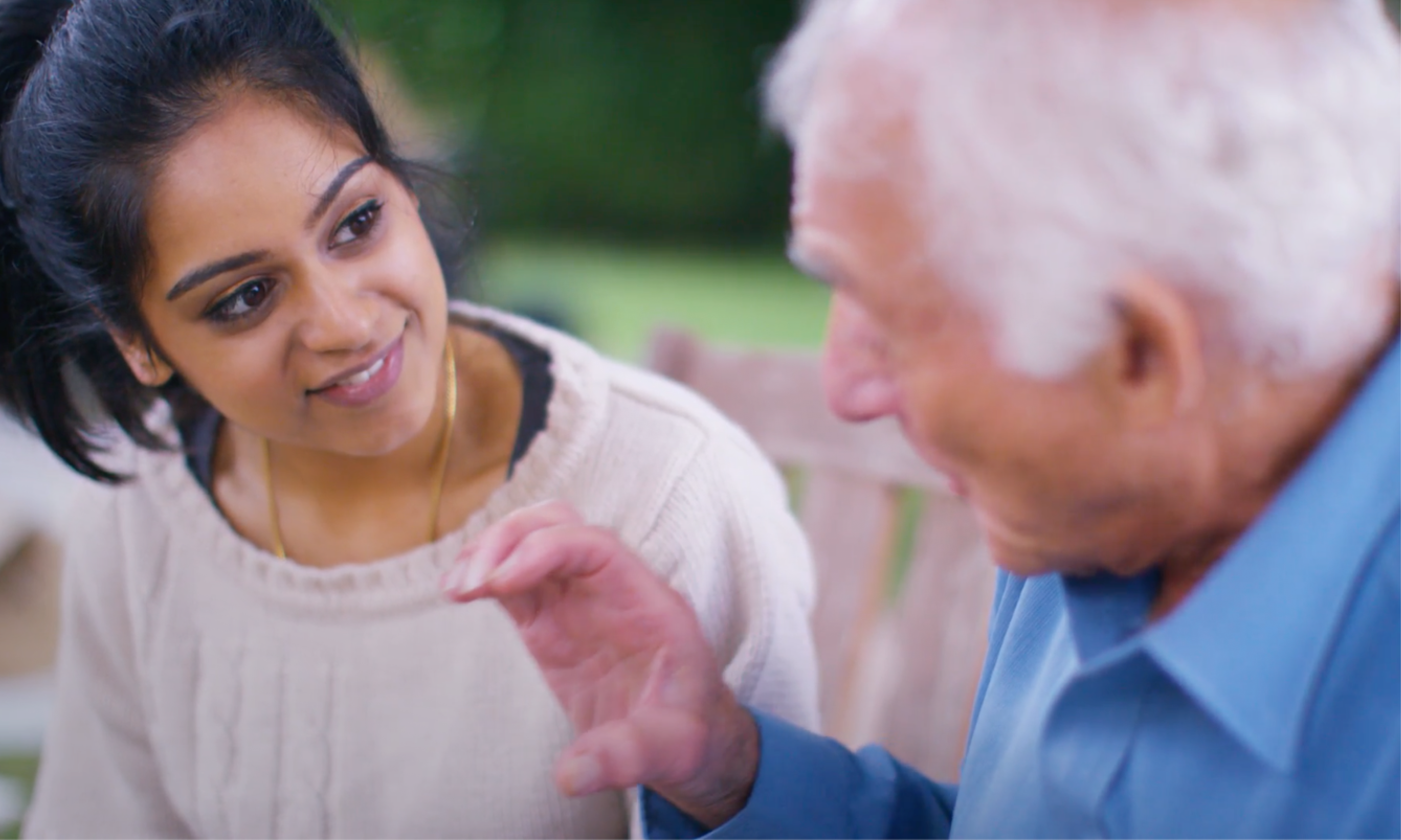A professional carer sharing a warm moment with an older person