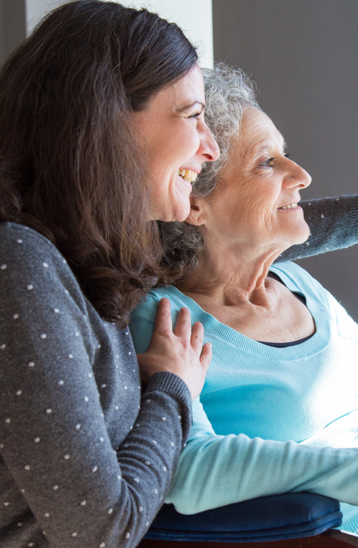 A carer and an older woman enjoying time together
