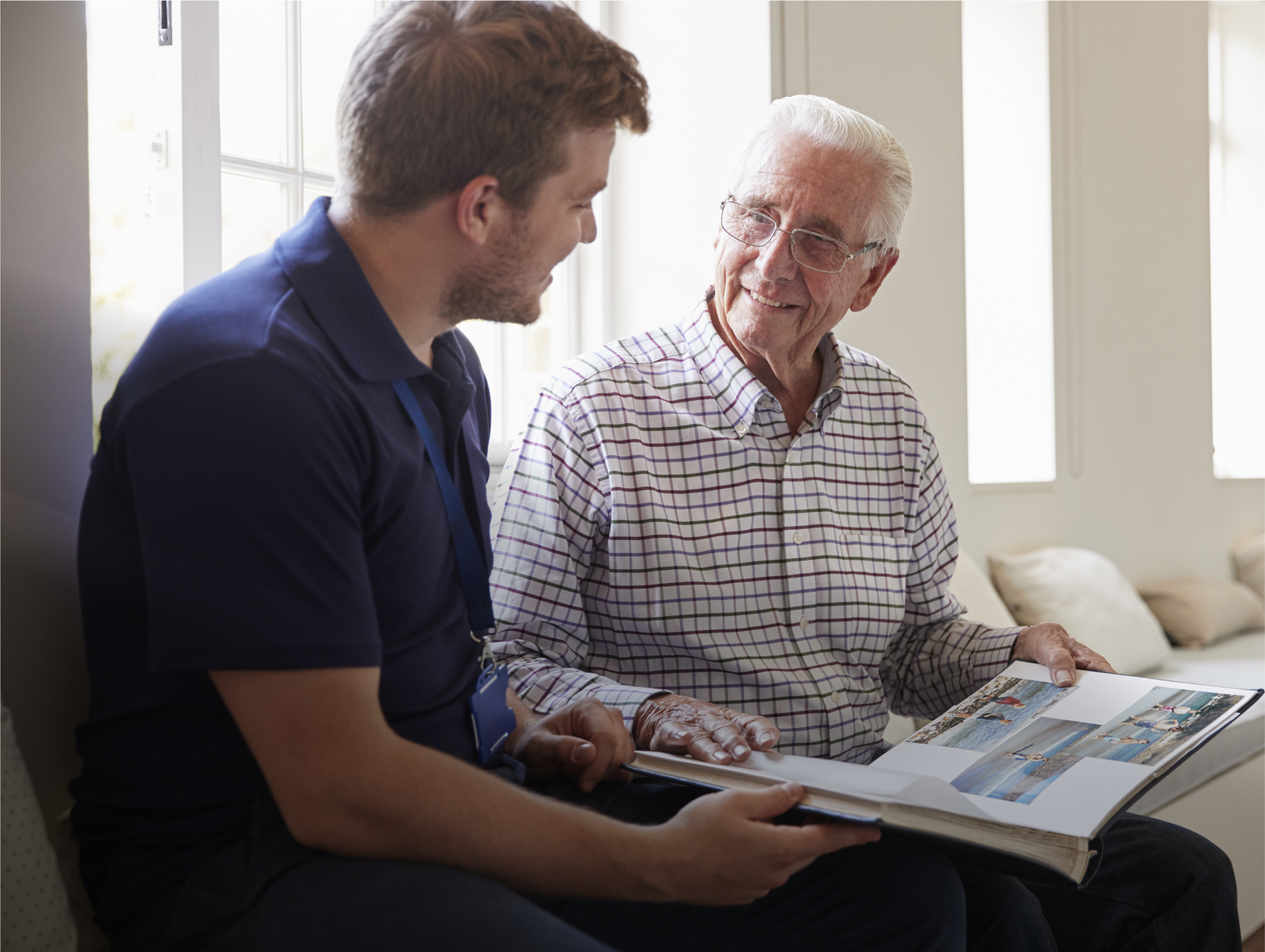 A professional carer sharing a moment with an older person at home